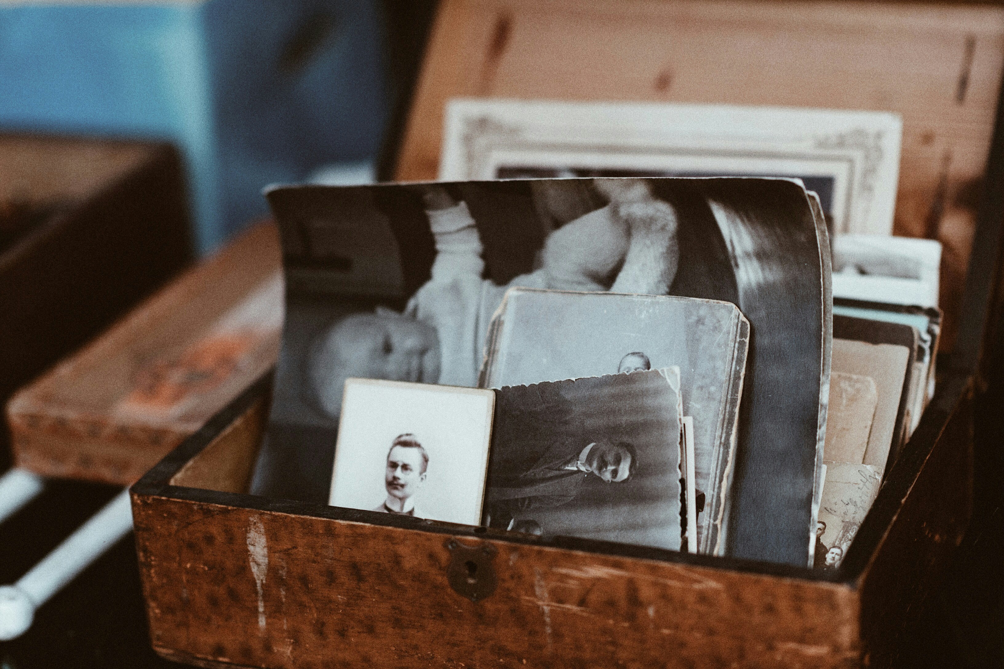 Old family photos in a wooden box